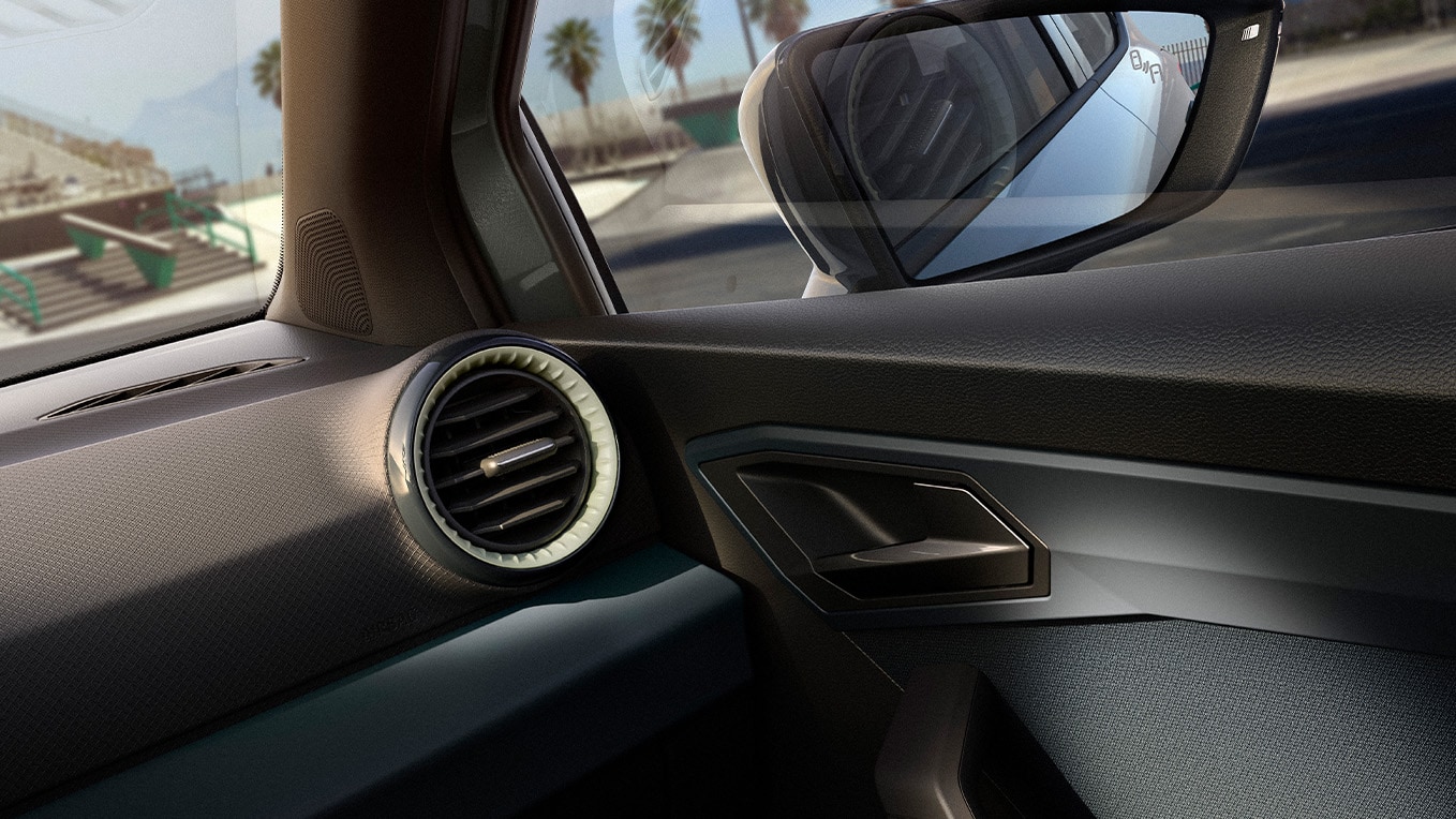 Partial interior view showcasing a few details and the right side-view mirror