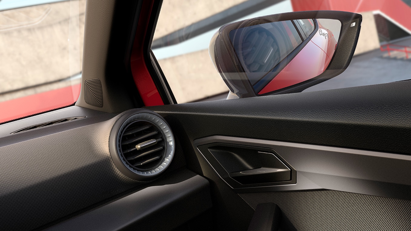 Partial interior view showcasing a few details and the right side-view mirror. 