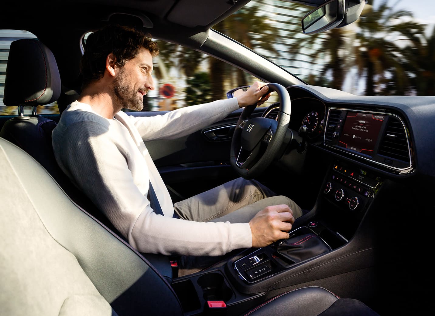 Side view of a driver in a SEAT car taken from the passenger place